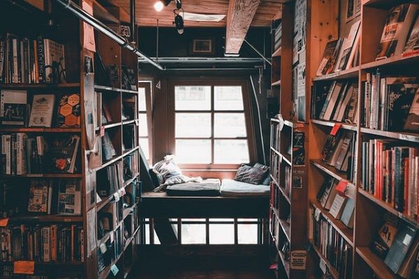 reading nook set in the window of a crowded bookstore