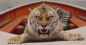 a still from a movie showing a tiger growling