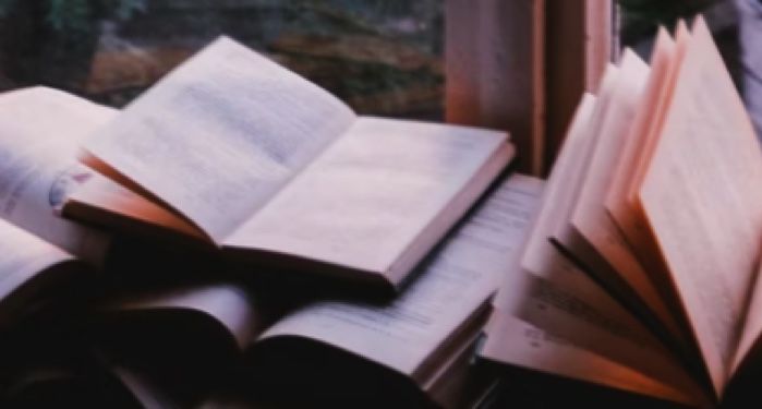 books open on a sunny windowsill; photo by John-Mark Smith for unsplash