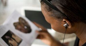 Image of a Black person reading