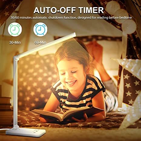 a photo of a kid reading under a white desk lamp with a foldable arm