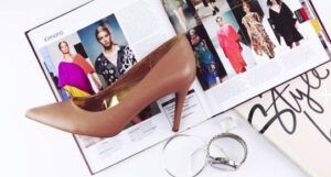 heeled sandal on top of magazine