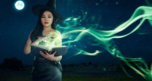 light-skinned Asian woman dressed as a witch and casting a green spell