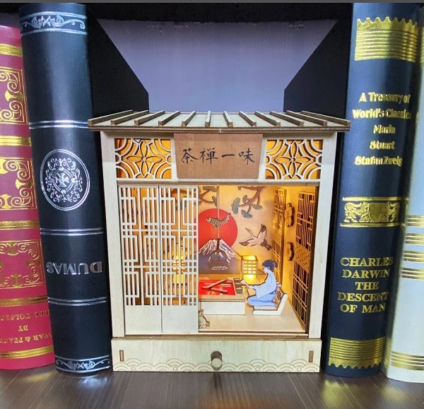 Image of a Booknook featuring a person making traditional Japanese tea in a old-style teahouse