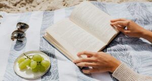 Image of a book on a beach towel