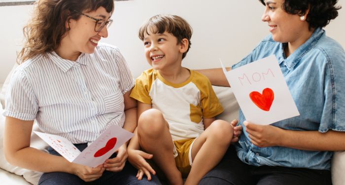 light-skinned lesbian family with kid