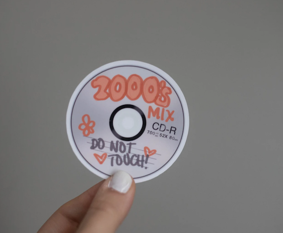 A single sticker shaped like a CD-R and labeled '2000's Mix'