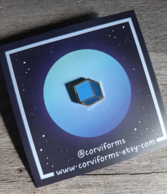 Enamel pin version of the morphing cube from Animorphs. 