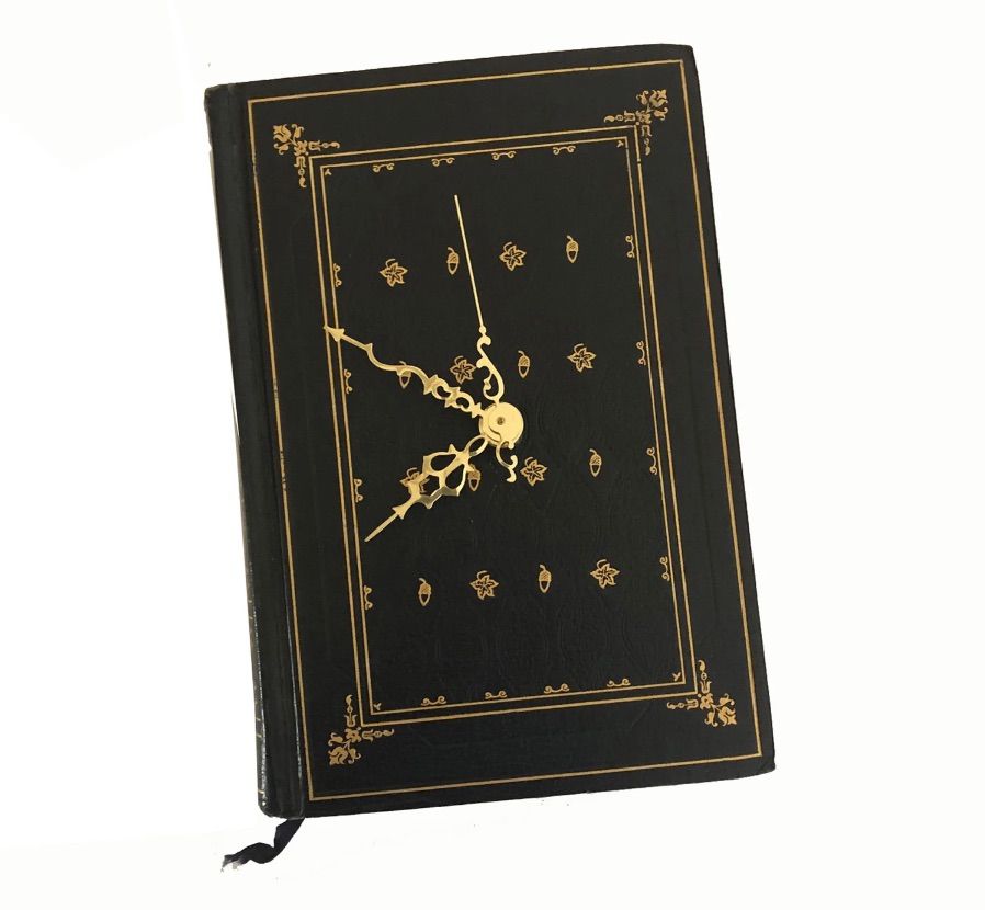 Image of a black book cover designed like a working clock.