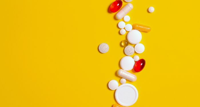 image of several drugs on a yellow background