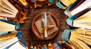 a Thanksgiving table setting overlaid with an image of books arranged in a circle, spines waving inward