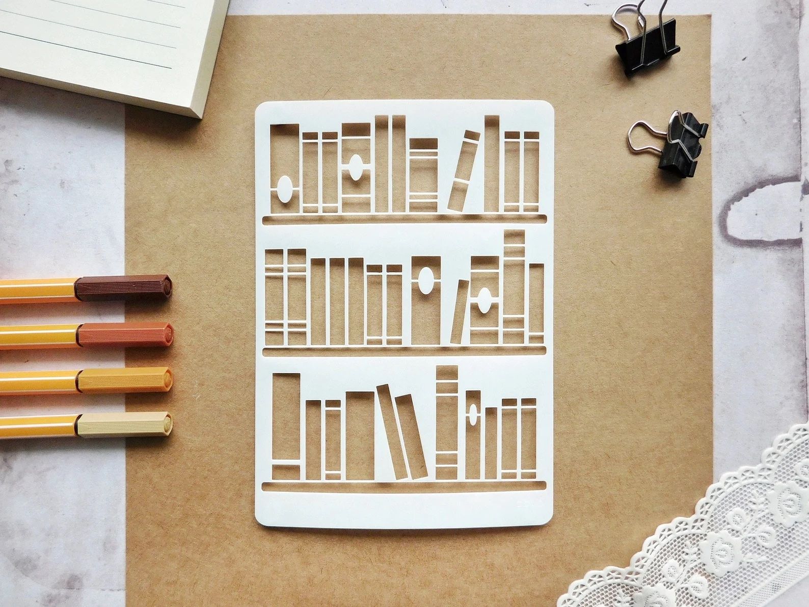 stencil depicting books on a shelf