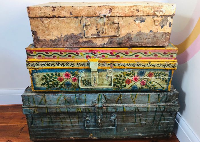 a photo of hand-painted antique travel trunks