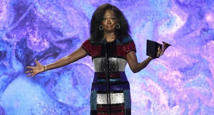 a still from the 2023 Grammys showing Viola Davis holding a Grammy during her acceptance speech