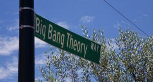 a street sign that says "big bang theory way" by trees