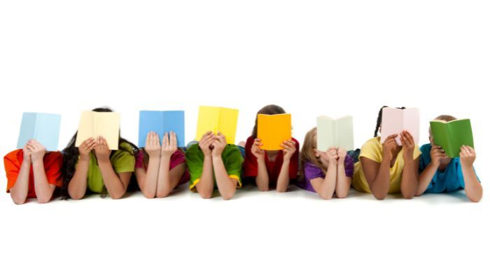 Image of 8 diverse children reading colorful books