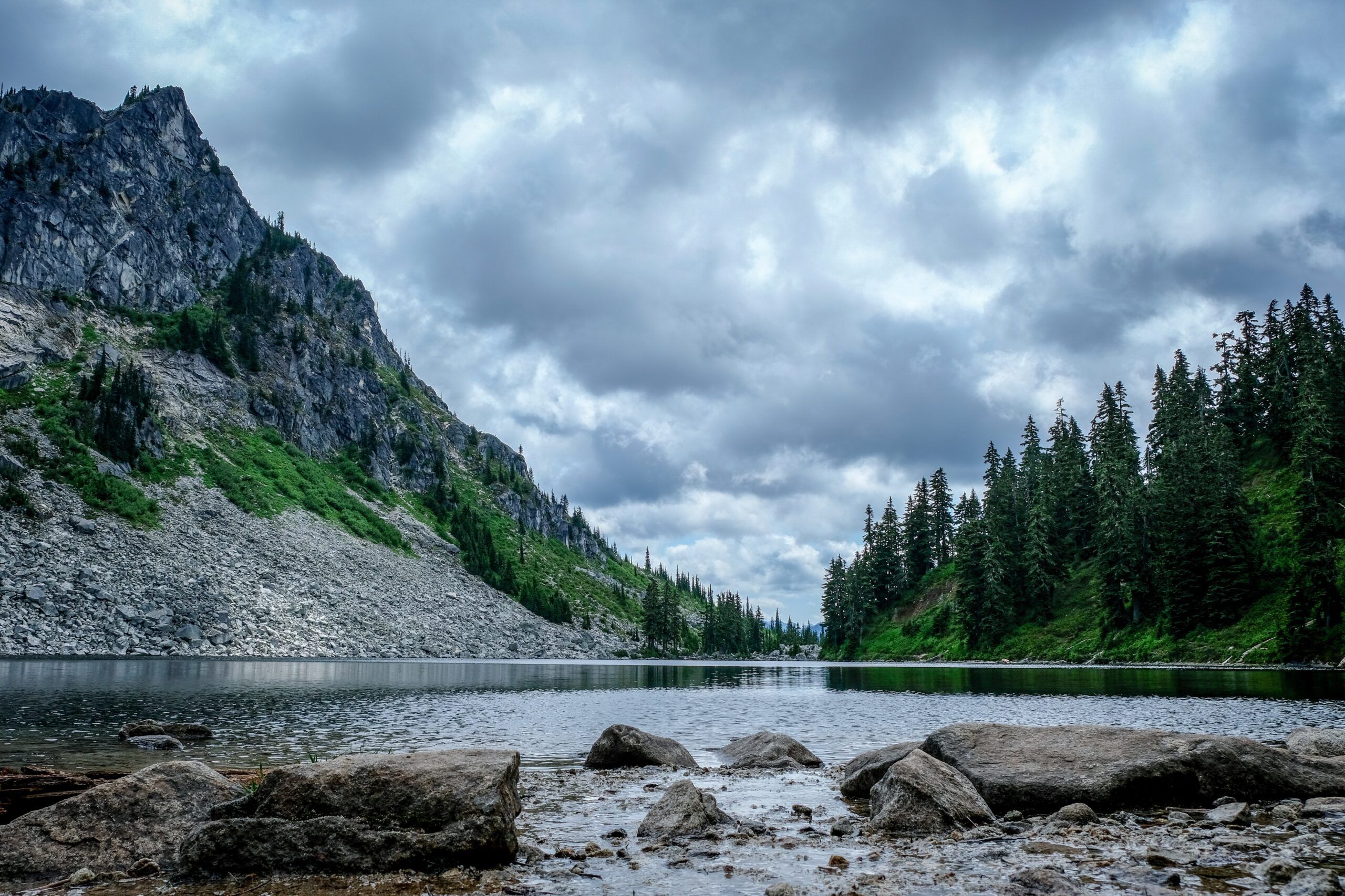 mountains and forest with river in between 