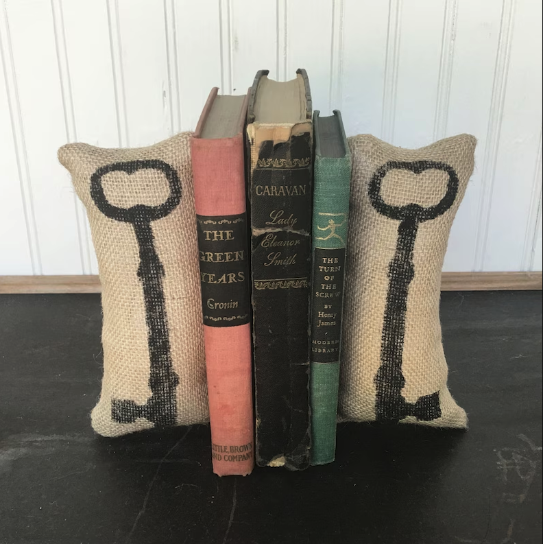 two burlap skeleton key bookends between three vintage books