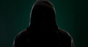 Dark image of a hooded figure