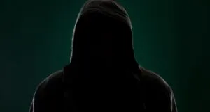 Dark image of a hooded figure