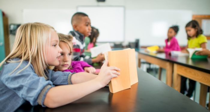 Image of middle graders reading in a classroom