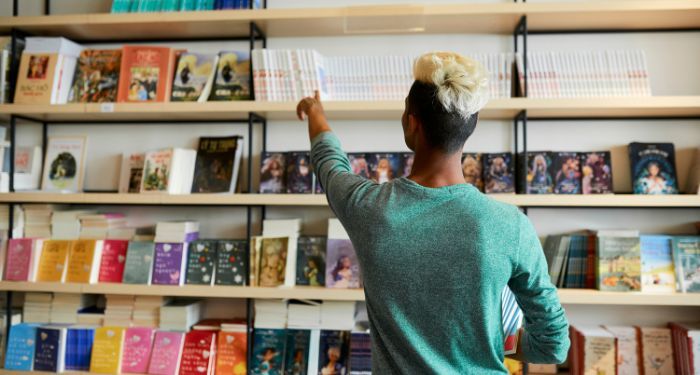 Image of a person with dark skin at a bookstore