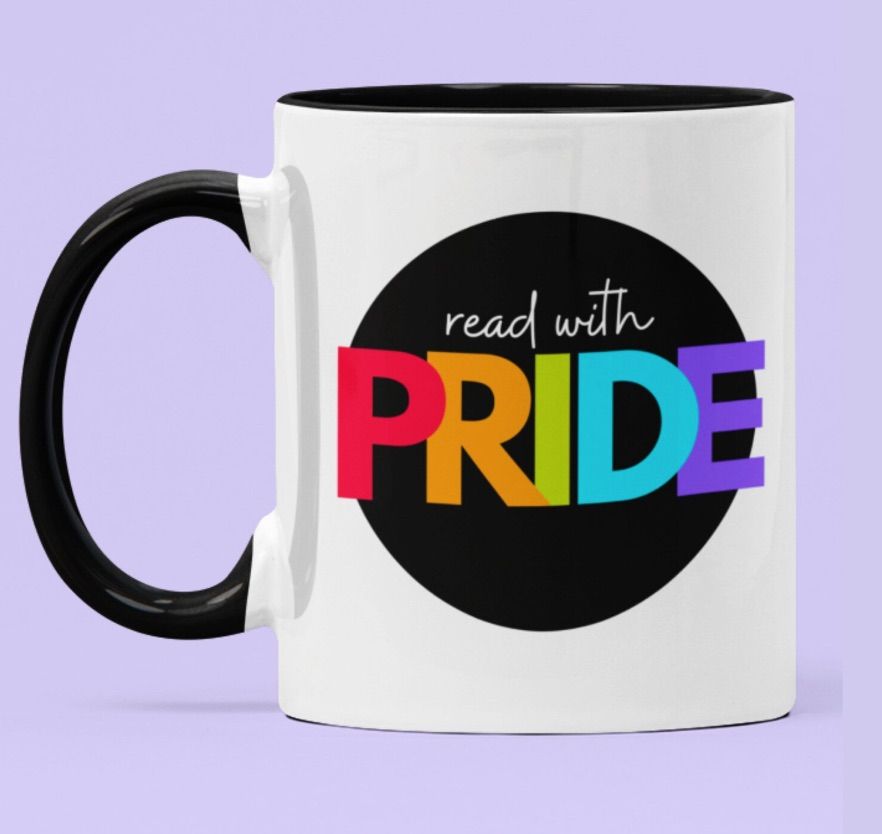 Image of a white mug that says "read with pride," and pride is in rainbow colors.