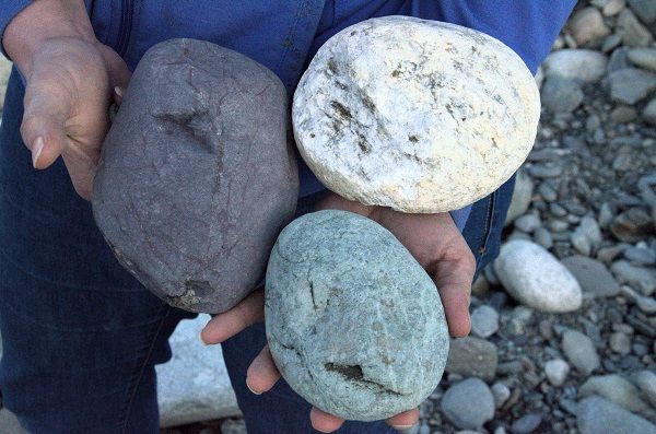 image of three large rocks, white, grey, and green