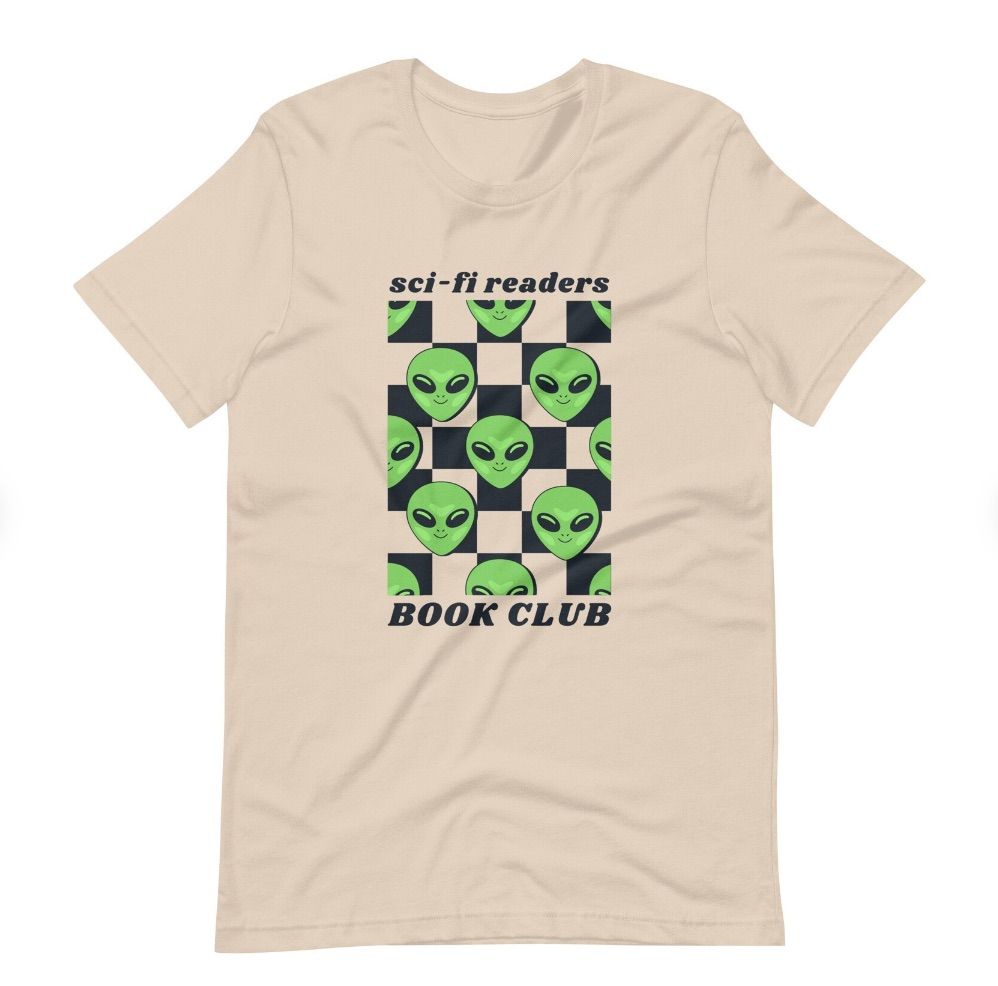 Image of a cream colored shirt with alien faces on a checkerboard. It sys "sci-fi readers book club."