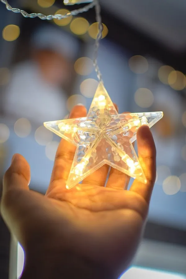 hand holding up a star light