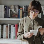 a woman browsing books at a bookstore