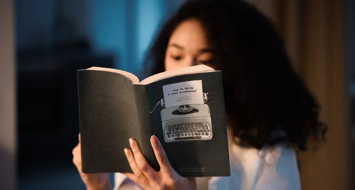 Image of a Black woman reading