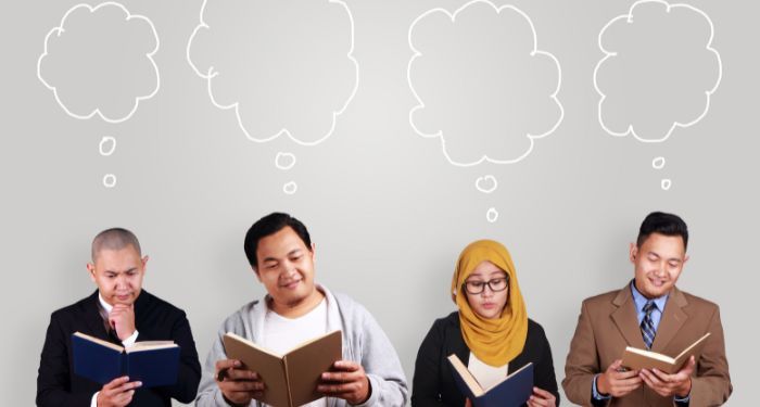 four people reading books