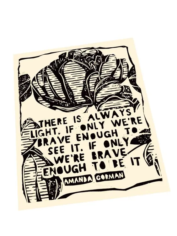 a letterpress print in cream and black with an Amanda Gorman quote and decorative border