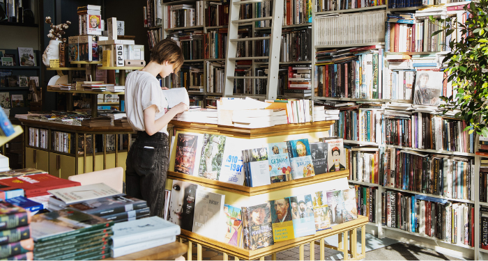 a photo of a person browsing a bookstore