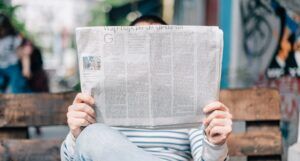 a person reading a newspaper