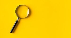 magnifying glass on yellow background