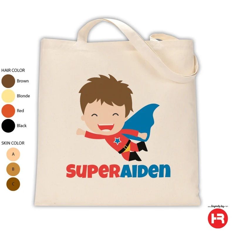 A tote bag with a cartoon image of a superhero flying above the words "Super Aiden"