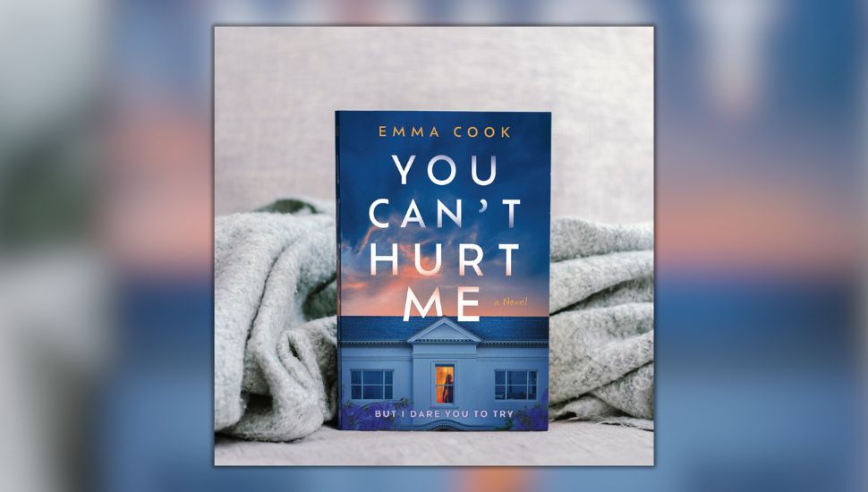 The book You Can't Hurt Me by Emma Cook, in front of a gray blanket