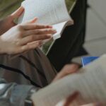 people holding books open