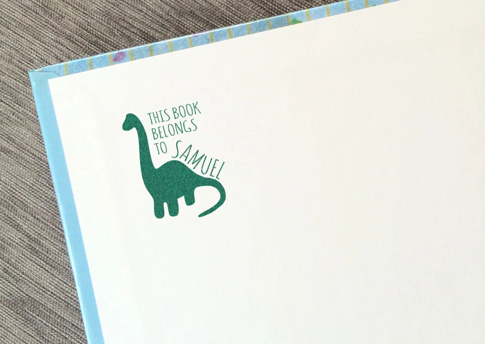 dinosaur book stamp cover