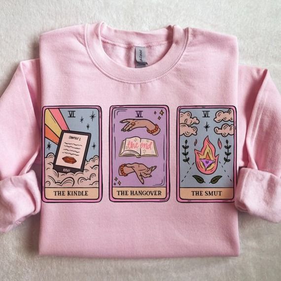 pink sweatshirt with three tarot  cards titled The Reader, The Hangover, and The Smut