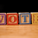 vote spelled out in blocks