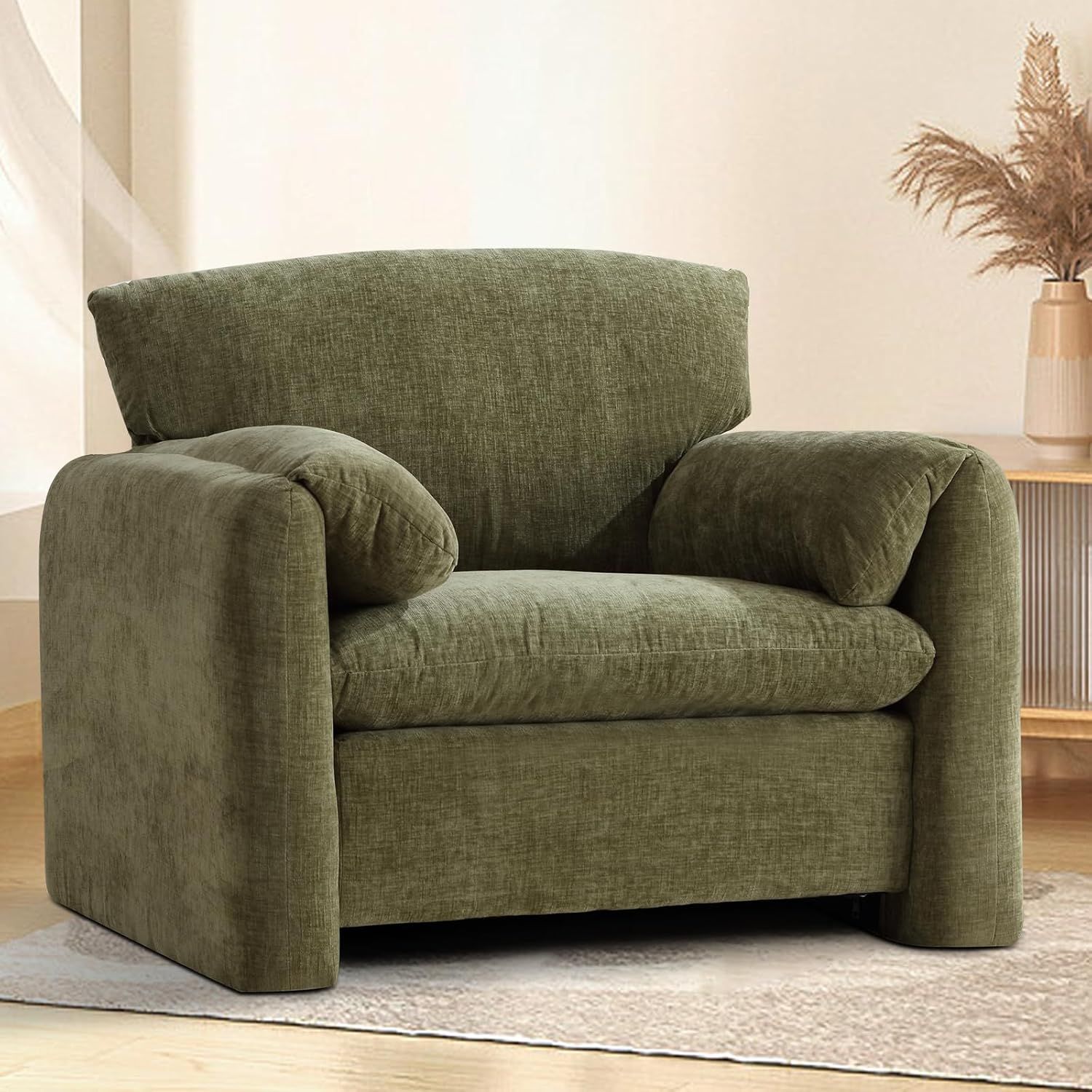 a green oversized armchair