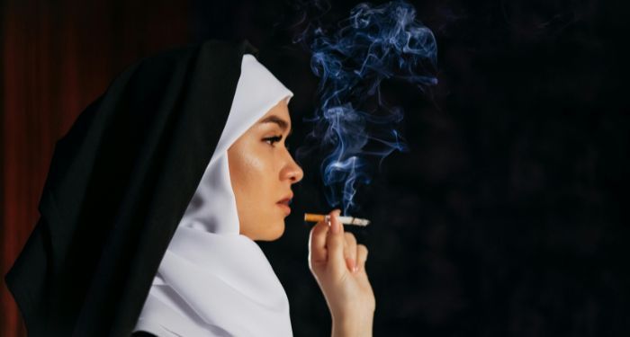 fair-skinned nun smoking